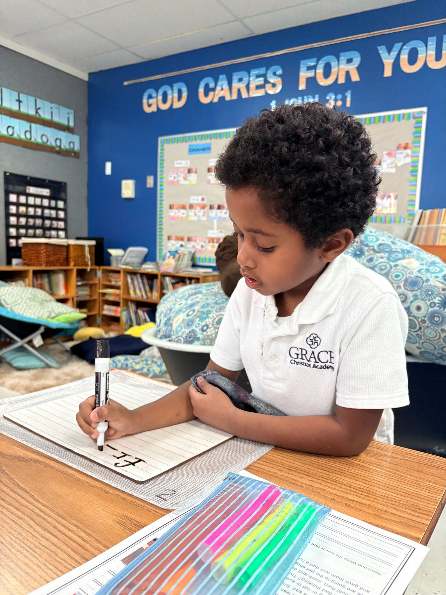 A Grace Christian Academy early-learner practicing handwriting